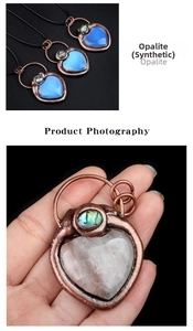 Detail of vintage heart pendant with synthetic opalite and bronze bezel setting