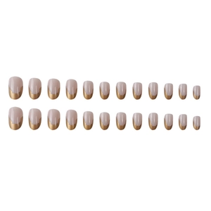 Short round nude pink press-on nails with irregular luxury gold foil french tips