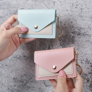 Mini envelope card holder in pastel blue and pink PU leather with gold keychain
