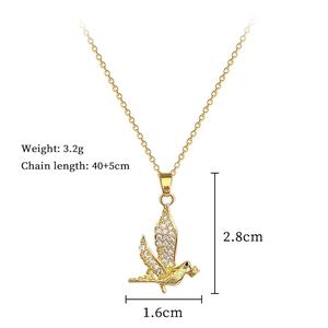 Detail view of swallow pendant with dimensions 2.8cm by 1.6cm and shiny cubic zirconia