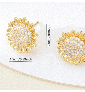 Macro shot showing 1.5cm diameter of golden sunflower earrings with cubic zirconia