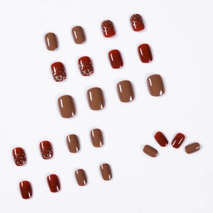 Short square glitter nail tips set in dark brown and Rembrandt red glossy finish