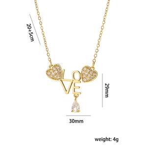 Golden LOVE heart pendant necklace with rhinestones and dimensions shown on white background