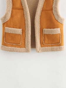 Brown faux suede vest with cream faux shearling trim shown on white background