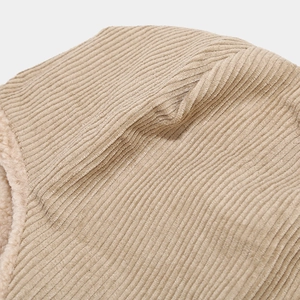 Detail of khaki corduroy fabric and thick warm sherpa lining for a winter trapper hat