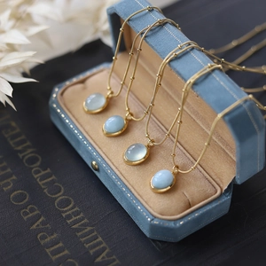 18K gold plated stainless steel necklaces with blue natural stones in a velvet box