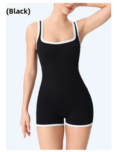 Detail of black ribbed fitness bodysuit with white contrast binding for women