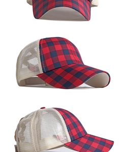 Detail view of red and blue checkered baseball cap with breathable mesh back and curved brim