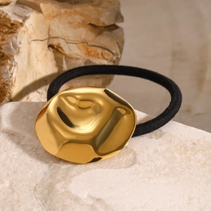 Polished 18k gold irregular metal charm on a thick black elastic hair tie for women