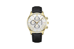Detailed macro view of white dial with golden Roman numerals and date window display