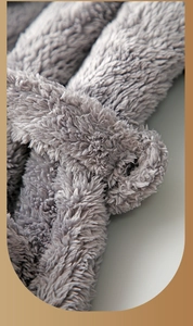Detailed close-up of thick gray coral fleece texture and plush fabric of the bathrobe