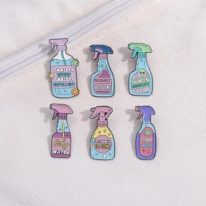 Set of 6 colorful pastel enamel spray bottle pins with anxiety repellent text