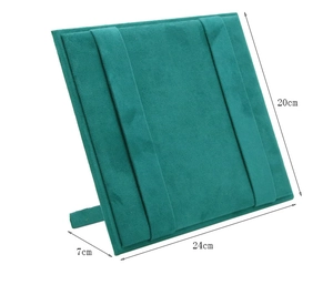 Detailed view of dark green faux suede jewelry stand with size dimensions 24cm by 20cm