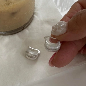 Minimalist U-shaped 925 sterling silver hoop earrings with a brushed metal texture finish