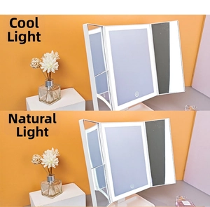 Detail of white tri-fold LED makeup mirror showing cold and natural light settings