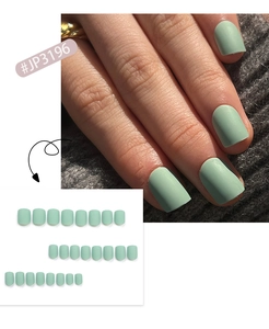 Close-up detail of matte mint green short square press-on nails with full set view