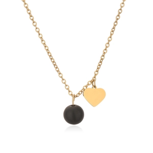 Detail of gold chain necklace with matte black bead and polished heart pendant charm