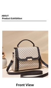 Detail of off-white crossbody bag with dark cross pattern and leather trim accents