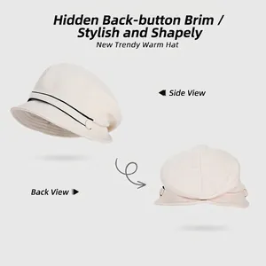 Chic beige plush fisherman hat with black trim and snap button brim for winter
