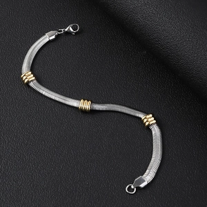 Close-up of a 6mm stainless steel snake chain bracelet with three golden ring accents