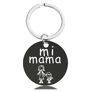 Detailed view of stainless steel keychain with engraved mi mama text and child illustration