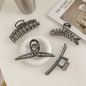Minimalist gunmetal hair claw clip set with polished metallic finish and diverse shapes