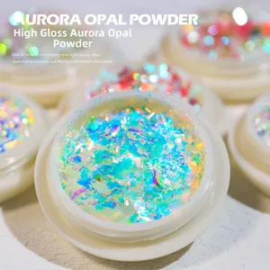Macro shot of iridescent aurora opal nail powder in a clear container for DIY manicure