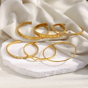 French style 18K gold plated hollow heart bangles with zircon set on white stones