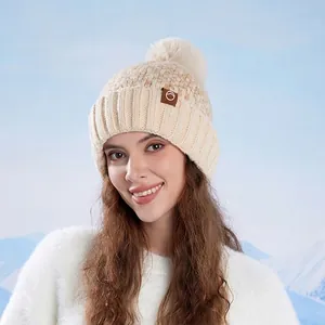 Women's knit pom-pom beanie in beige with ear protection and warm fleece lining