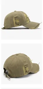 Close-up of olive green distressed baseball cap with ripped fabric and C embroidery
