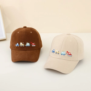Detailed embroidery of cartoon construction vehicles on two kids' baseball caps
