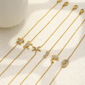 6-piece gold stainless steel ocean charm bracelets with sea turtle and dolphin charms
