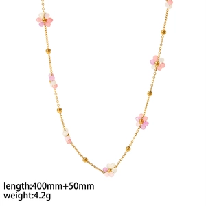 Macro shot of 18K gold plated flower necklace with pink and purple beads, length 40cm+5cm