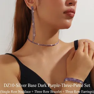 Detail view of purple rhinestone jewelry set including choker, bracelet and long earrings