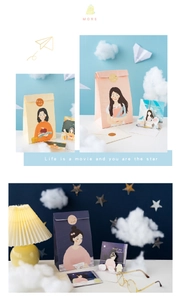 Detailed view of teacher appreciation gift bags with greeting cards and floral illustrations