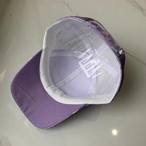 Detail view of purple kids baseball cap interior with white sweatband and support frame