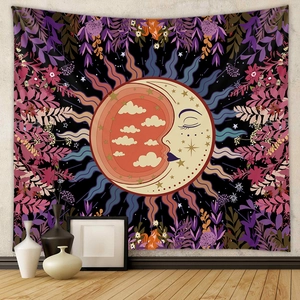 Detail of Bohemian sun and moon tapestry with gold clouds and floral border patterns