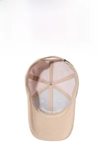 Detail view of khaki baseball cap interior with reinforced stitching and breathable eyelets