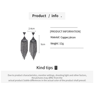 Detail view of long black zircon tassel earrings with copper material specs and dimensions