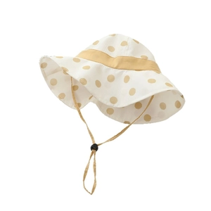 Girl's beige polka dot sun hat with yellow ribbon and adjustable chin strap for summer