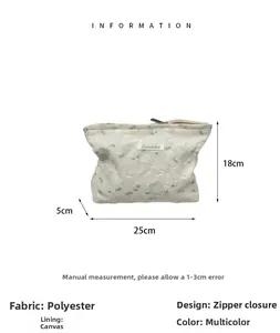 Detail view of jacquard rose cosmetic bag with size measurements and polyester texture