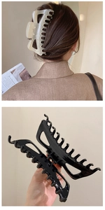Detail of 14cm large cream and black claw clips for thick hair in French style
