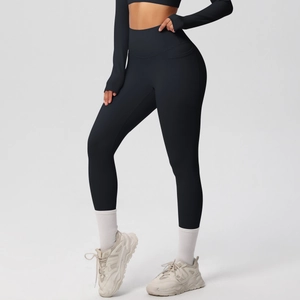 Detailed view of women's black high-waisted yoga leggings featuring side utility pockets