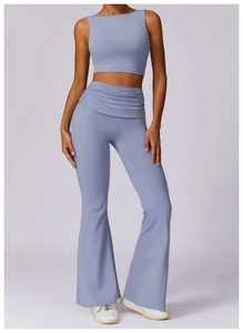 Detail of high-waist flared yoga pants and racerback top in breathable lavender fabric