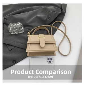 Mini cream crossbody bag with gold buckle and smartphone for scale reference