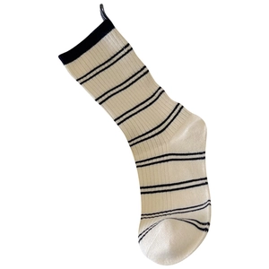 Off-white cotton crew socks with black stripes and ribbed cuffs for a casual daily look