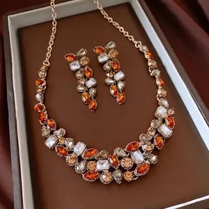 Vintage water drop jewelry set with necklace and earrings in gold-tone and orange crystals