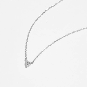Close-up of S925 sterling silver heart pendant with shimmering pavé diamonds and fine O-chain