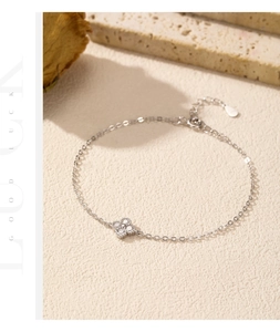 Close-up of S925 sterling silver four-leaf clover bracelet with sparkling cubic zirconia