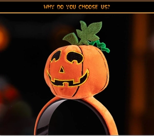 Detailed view of plush orange pumpkin headband with green leaf and embroidery for Halloween